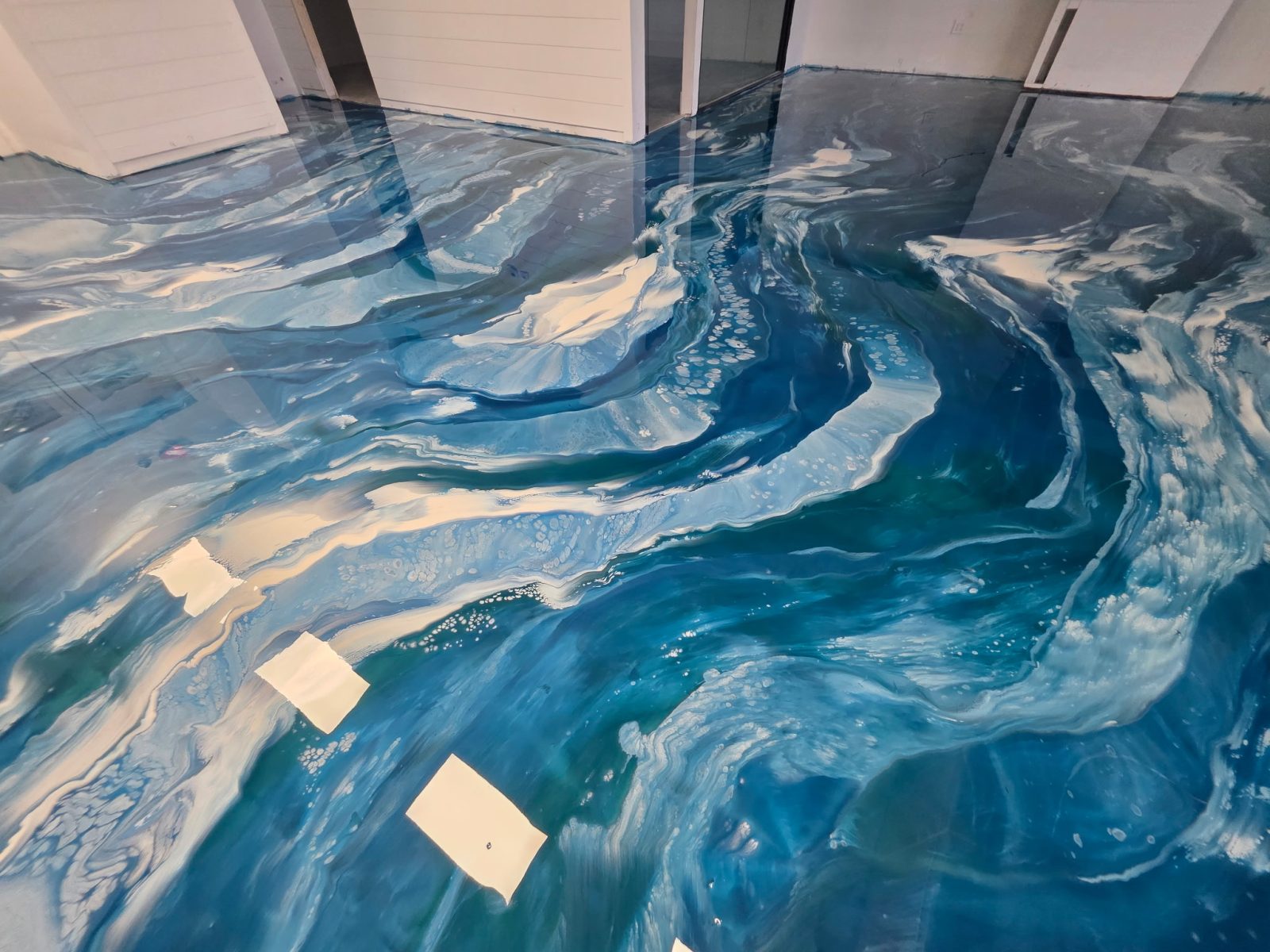 Deep teal oceanic metallic epoxy floor